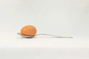 Egg-in-spoon-on-a-white-background