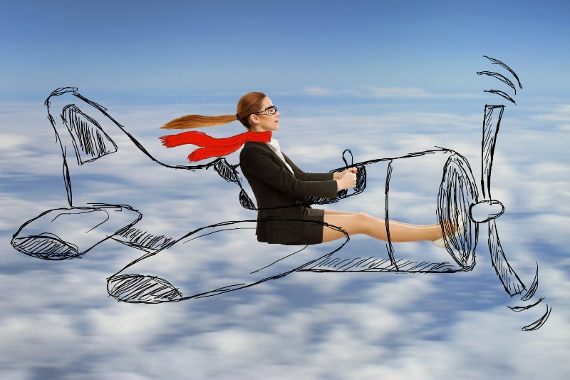 Fliegerfrau-mit-Schal-und-Brille-die-entworfenes-Flugzeug-fliegt